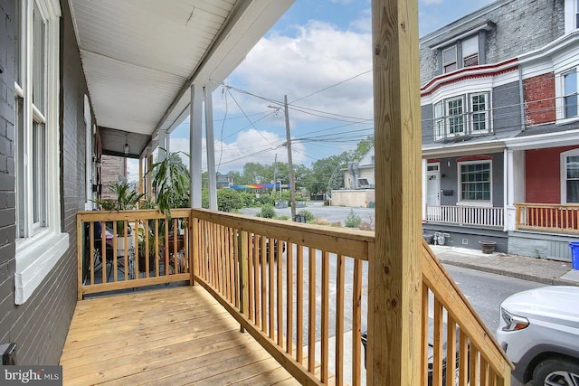 wooden terrace featuring a porch