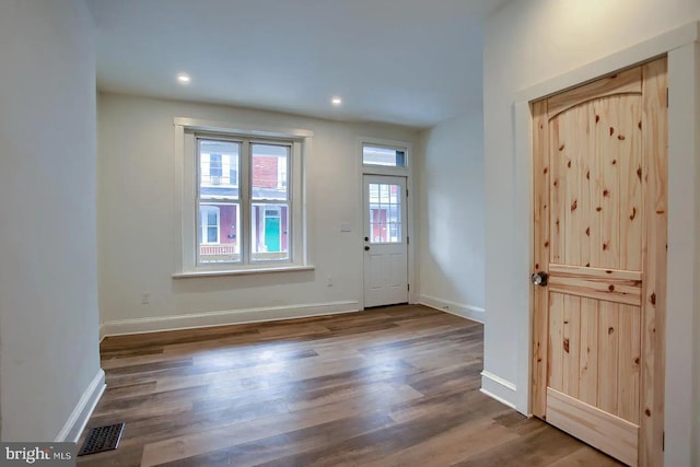 foyer entrance featuring dark hardwood / wood-style flooring