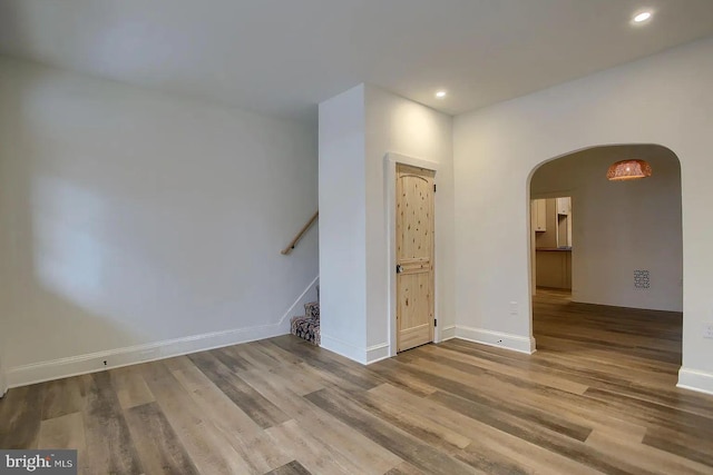 unfurnished room with hardwood / wood-style flooring