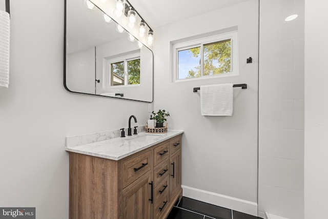 bathroom with tile patterned flooring and vanity