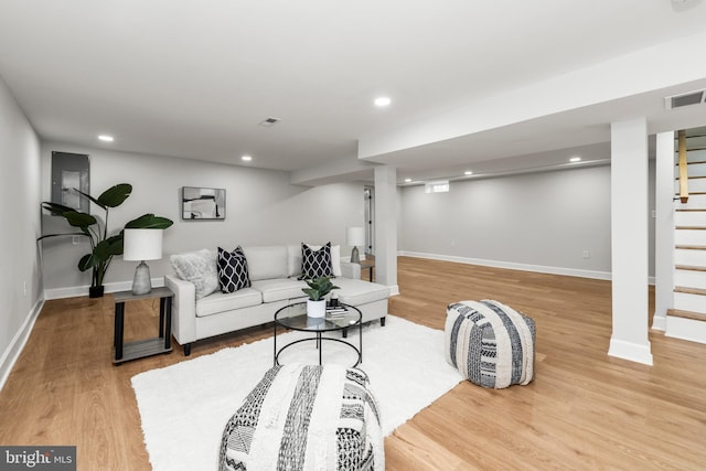 living room with light hardwood / wood-style flooring