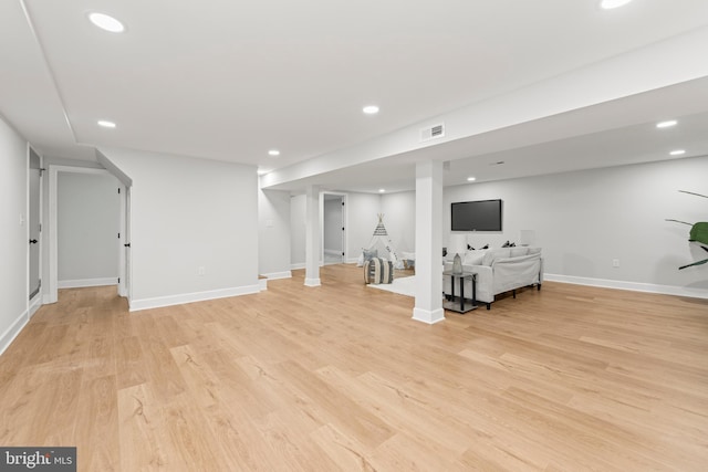 basement featuring light hardwood / wood-style floors