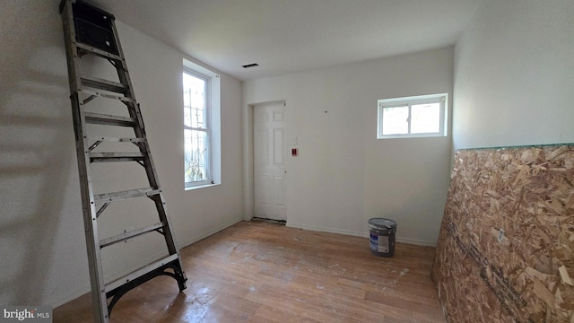 spare room with light hardwood / wood-style flooring