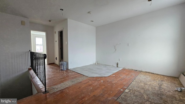 empty room with hardwood / wood-style floors