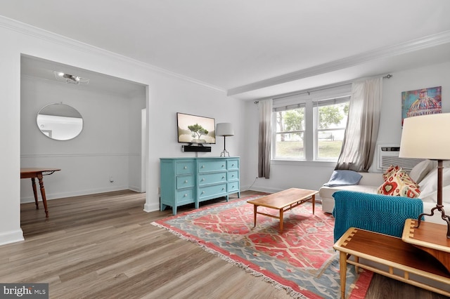 living area featuring hardwood / wood-style flooring, cooling unit, and crown molding