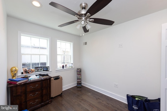 miscellaneous room with dark hardwood / wood-style floors, radiator, and ceiling fan