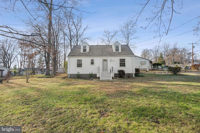 back of house featuring a yard