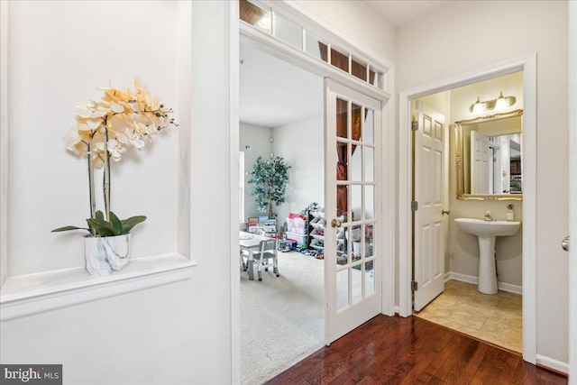 hallway featuring dark hardwood / wood-style flooring and sink