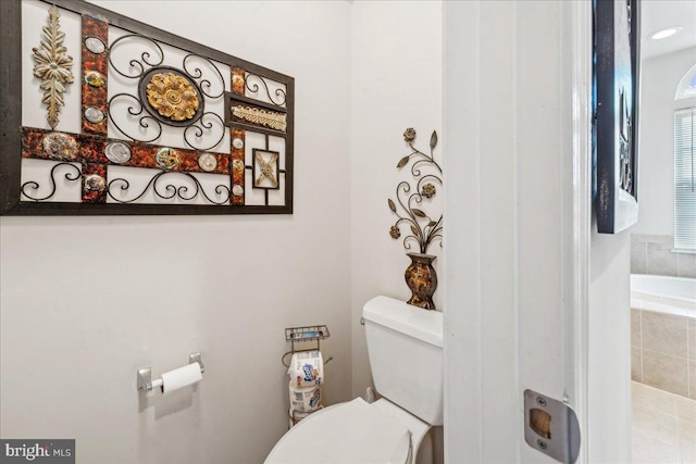 bathroom with tile patterned floors and toilet