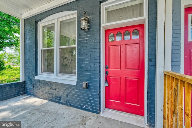 entrance to property with a porch