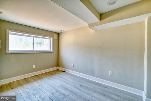 unfurnished room with light hardwood / wood-style flooring