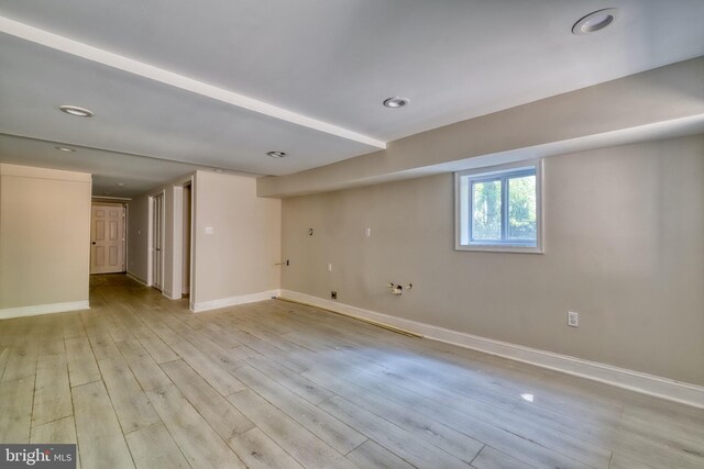 basement featuring light hardwood / wood-style floors