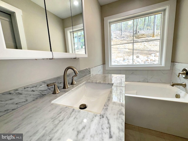 full bathroom with a bath and a sink