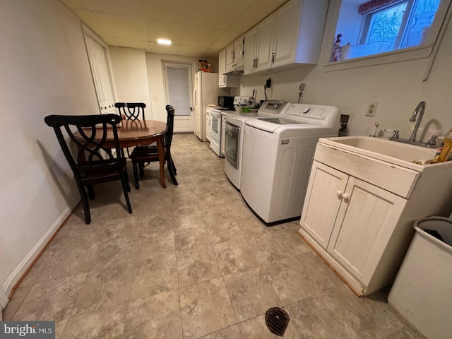 laundry area featuring washer and clothes dryer and sink