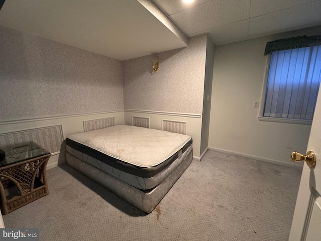 bedroom featuring light colored carpet