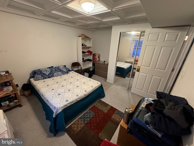 bedroom featuring light colored carpet and coffered ceiling