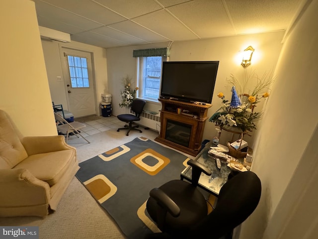 carpeted living room with radiator heating unit