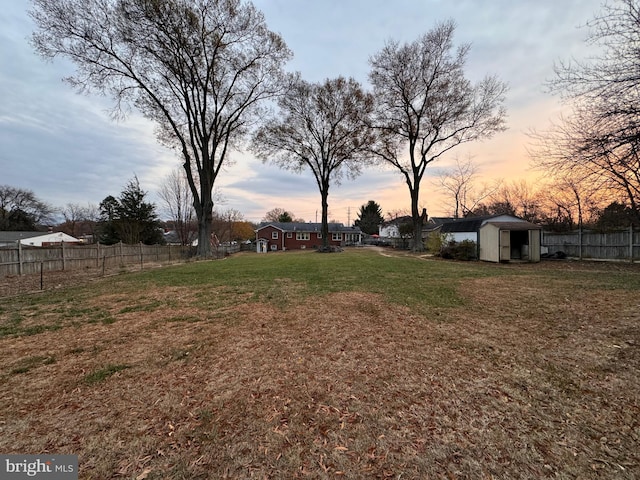 yard at dusk with a shed