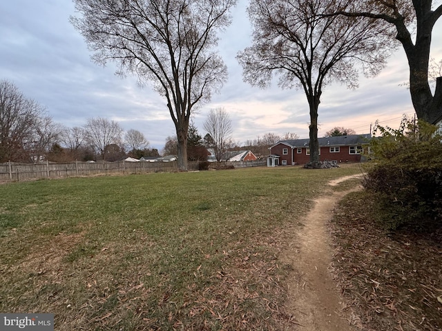 view of yard at dusk