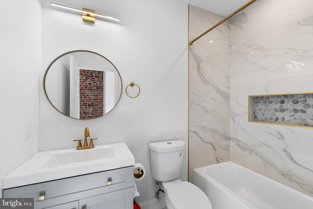 full bathroom with vanity, tiled shower / bath combo, and toilet