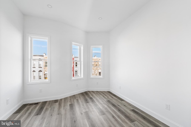 spare room with light hardwood / wood-style flooring