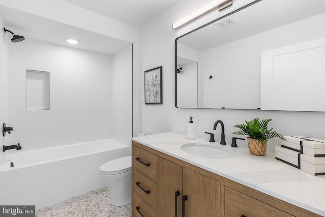 full bathroom featuring vanity, toilet, and  shower combination