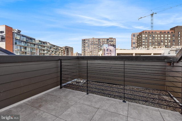 view of patio featuring a balcony