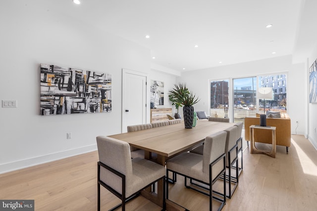 dining area with light hardwood / wood-style floors