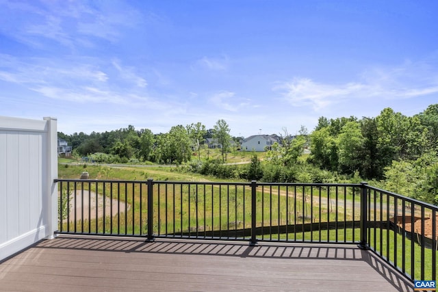 wooden deck with a yard