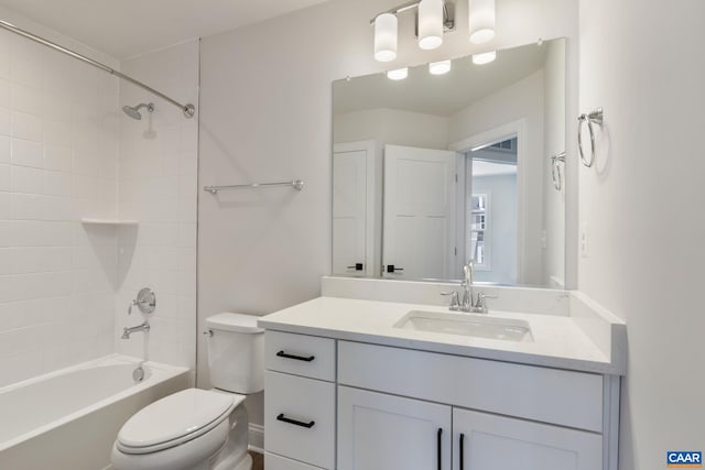 full bathroom featuring vanity, toilet, and tiled shower / bath combo