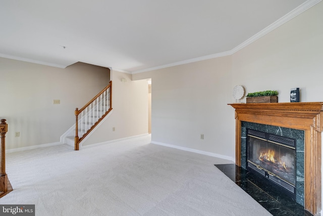 living room featuring dark carpet, crown molding, and a high end fireplace