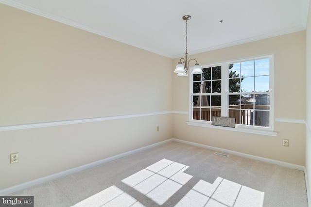 spare room with ornamental molding, light colored carpet, and an inviting chandelier