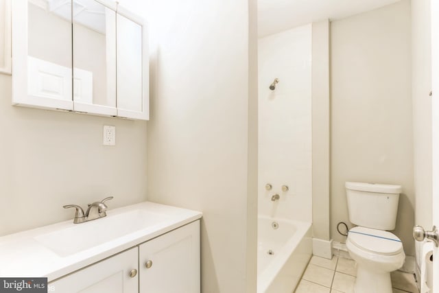 bathroom featuring tile patterned flooring, vanity, and toilet