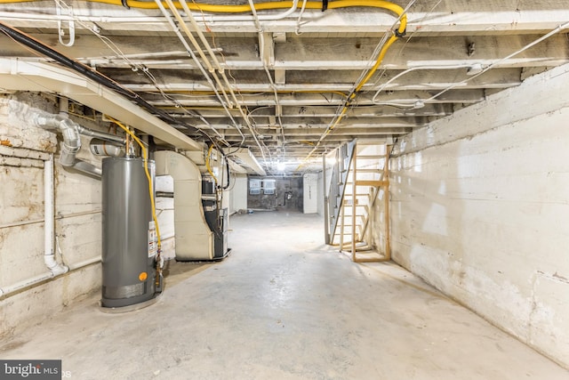 basement featuring heating unit and gas water heater