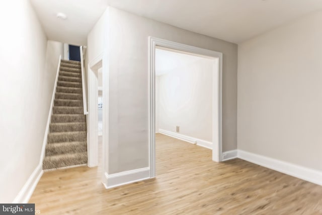 stairway featuring wood-type flooring