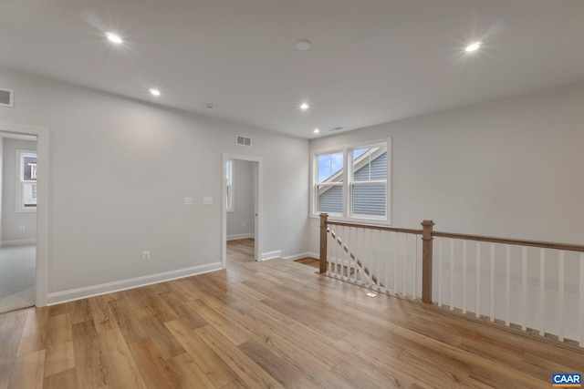 unfurnished room featuring light hardwood / wood-style floors