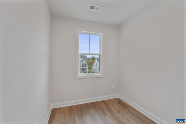 spare room with light wood-type flooring