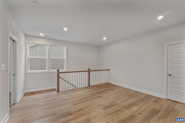 spare room with light wood-type flooring