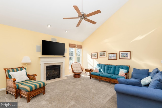 carpeted living area featuring a fireplace with flush hearth, high vaulted ceiling, recessed lighting, baseboards, and ceiling fan