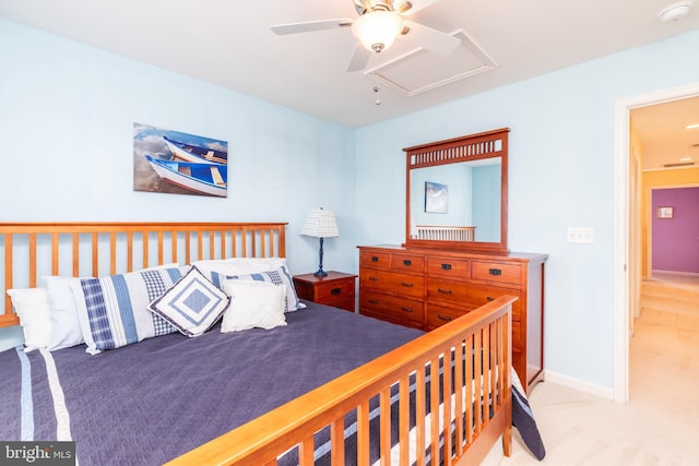 bedroom featuring baseboards, carpet floors, attic access, and ceiling fan