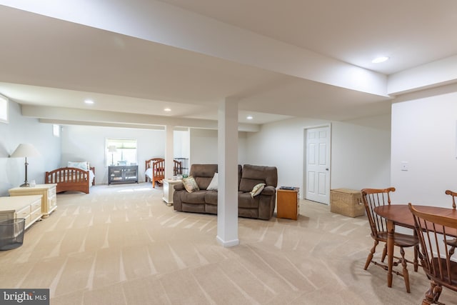 below grade area featuring recessed lighting and light carpet