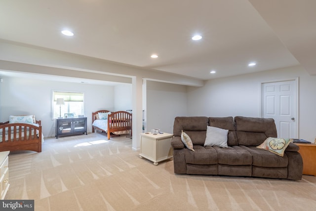 living room with recessed lighting and light colored carpet