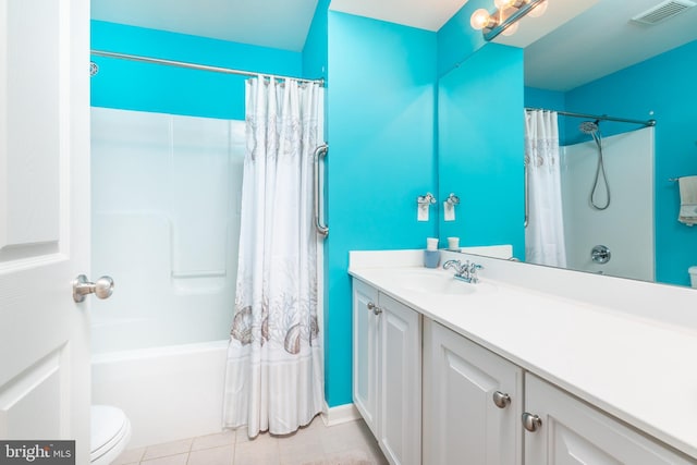 bathroom featuring vanity, visible vents, tile patterned flooring, shower / tub combo, and toilet