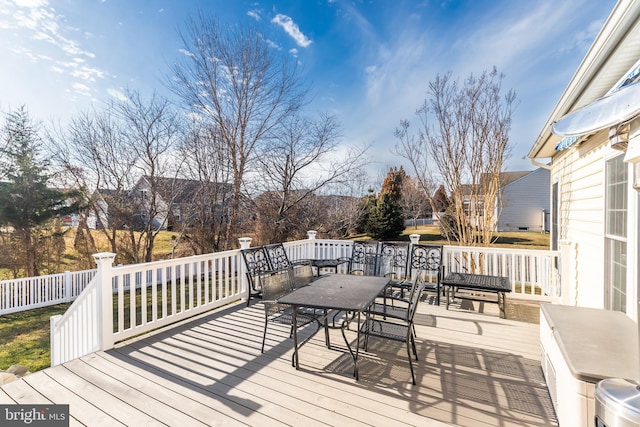 wooden deck featuring outdoor dining space