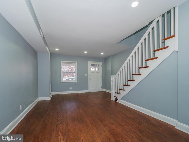 foyer entrance with dark hardwood / wood-style flooring