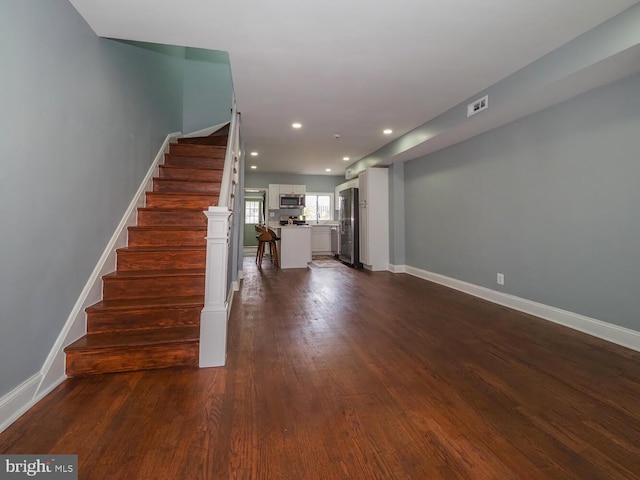 staircase featuring hardwood / wood-style flooring