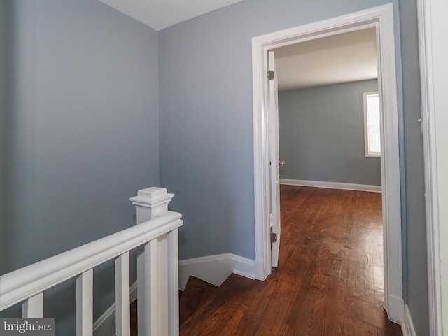 corridor featuring dark hardwood / wood-style flooring