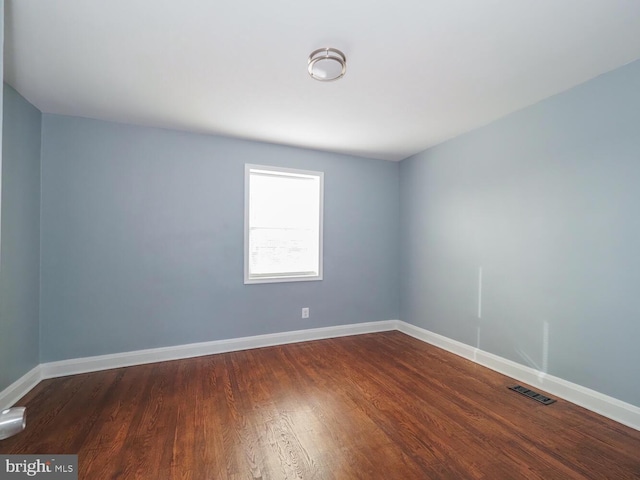 empty room featuring wood-type flooring