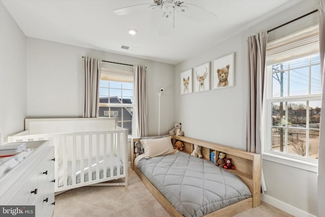 carpeted bedroom with ceiling fan