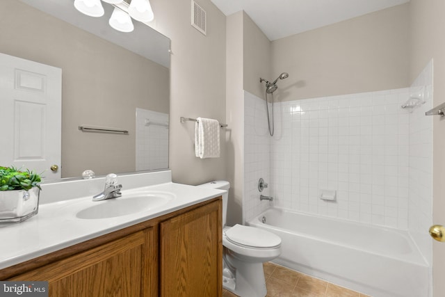 full bathroom with visible vents, toilet, tub / shower combination, vanity, and tile patterned floors